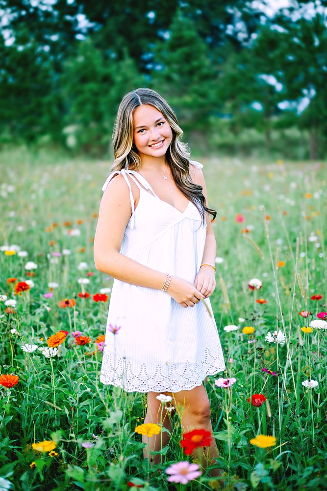 Portrait standing in a wildflower field